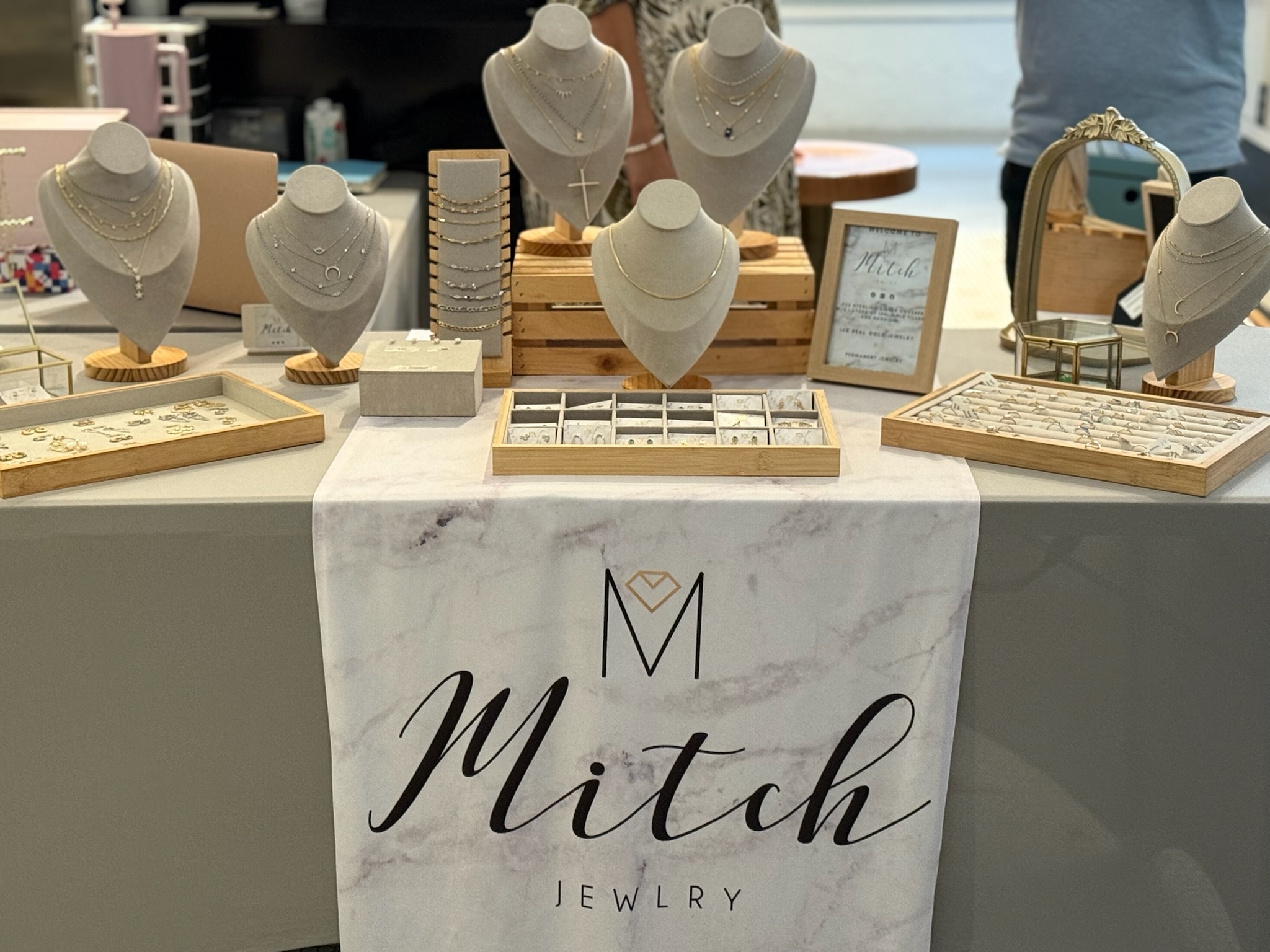 Real jewelry vendor table at a fayVen community pop-up